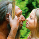 Left: A reconstruction of an adult Neanderthal. Right: A non-reconstructed, actual human girl.